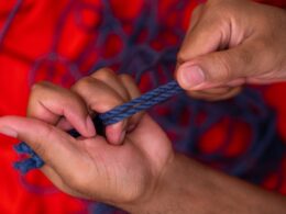 person holding blue and white rope