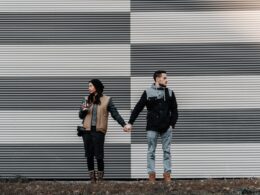 man and woman holding each other's hands